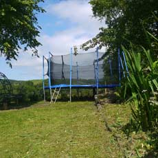 large trampoline for kids at holiday house