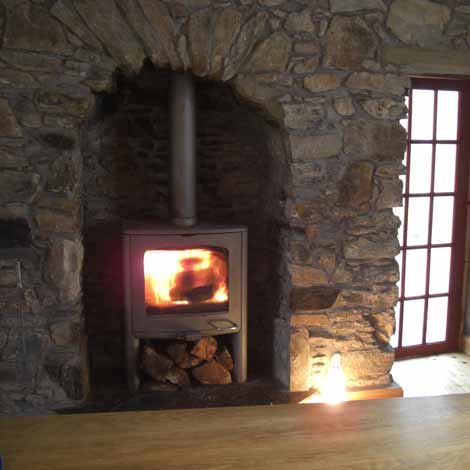 wood burning stove in kitchen of kilfinan holiday house.